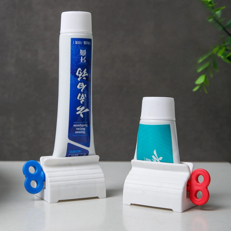 Product image KAMJE Dispenser Alat Penjepit Jepitan Penekan Odol Pasta Gigi Roll Putar KMJ140 KMJ140 RANDOM