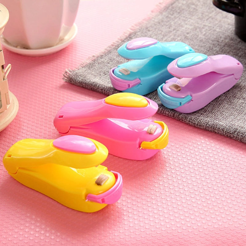 Product image KAHASIL - Alat Pres Perekat Kemasan Plastik Snack Makanan Elektrik Hand Mini Sealer Portable KMJ180 UNGU