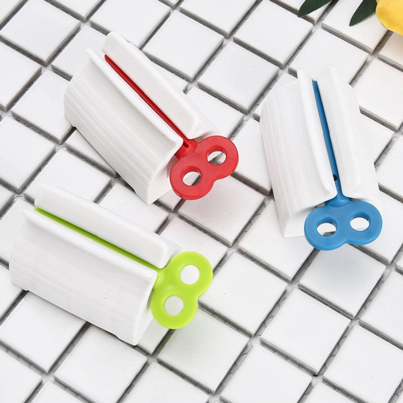 Product image KAMJE Dispenser Alat Penjepit Jepitan Penekan Odol Pasta Gigi Roll Putar KMJ140 KMJ140 RANDOM