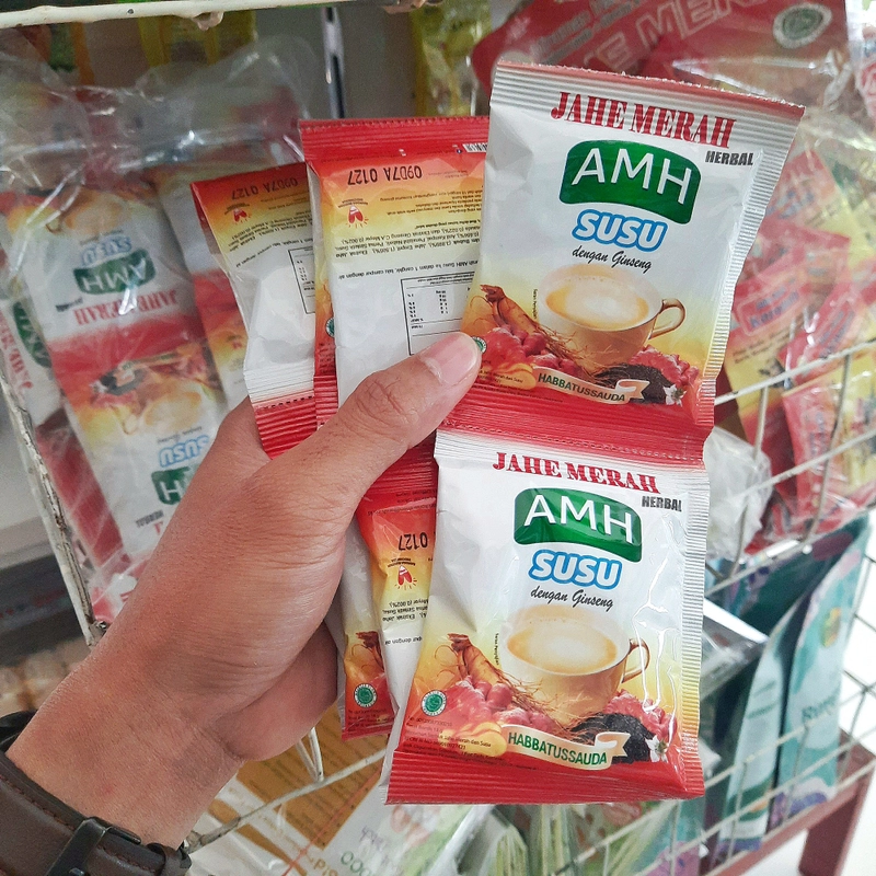 Product image JAHE MERAH HERBAL SUSU + GINSENG AMH - Minuman Serbuk Jahe Merah Susu Dengan Ginseng (1 Renceng) 24gr Sachet