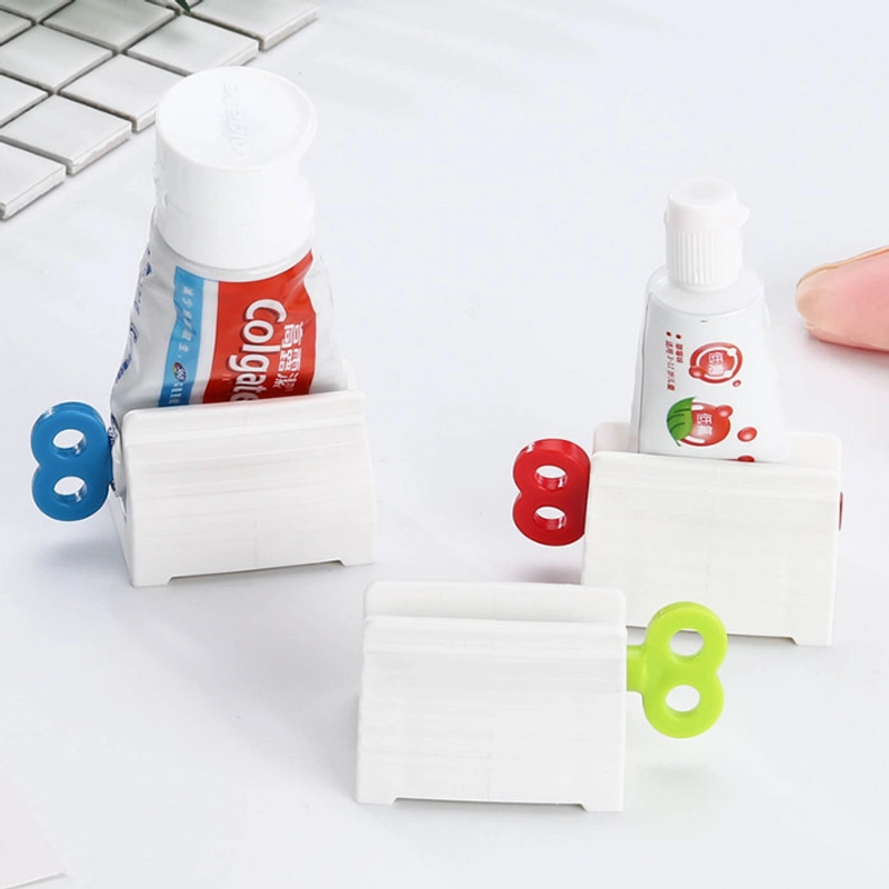 Product image KAMJE Dispenser Alat Penjepit Jepitan Penekan Odol Pasta Gigi Roll Putar KMJ140 KMJ140 RANDOM