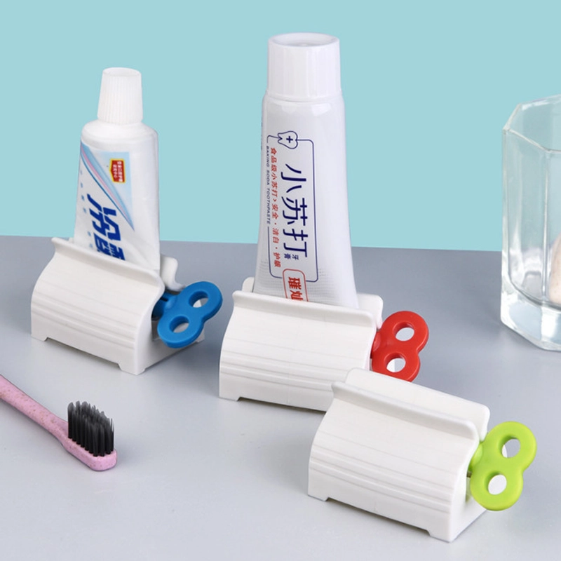 Product image KAMJE Dispenser Alat Penjepit Jepitan Penekan Odol Pasta Gigi Roll Putar KMJ140 KMJ140 RANDOM